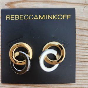 Double hoop earrings, gold and silver hoops in each.